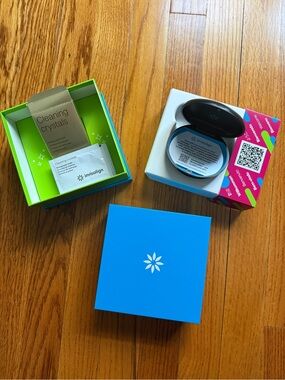 Blue Retainer Storage Case with Cleaning Crystals and black retainer case